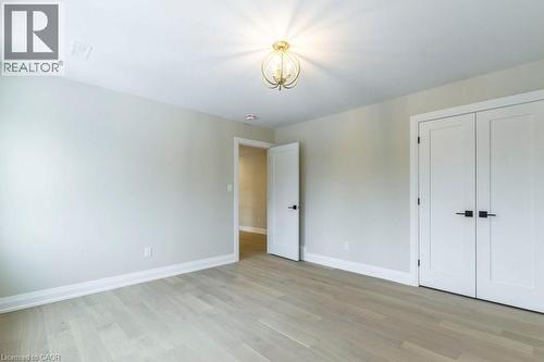 Unfurnished bedroom with light wood finished floors and a closet - 1105 Main Street E, Cambridge, ON - Indoor Photo Showing Other Room