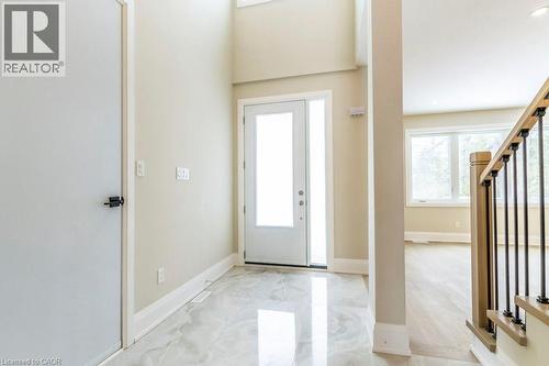 Entrance foyer with stairway and baseboards - 1105 Main Street E, Cambridge, ON - Indoor Photo Showing Other Room
