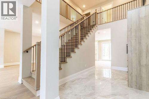 Staircase with recessed lighting, a high ceiling, and marble tiled flooring - 1105 Main Street E, Cambridge, ON - Indoor Photo Showing Other Room