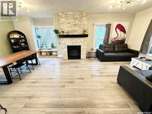 416 3Rd Street Se, Weyburn, SK - Indoor Photo Showing Living Room With Fireplace