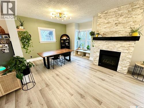 416 3Rd Street Se, Weyburn, SK - Indoor Photo Showing Living Room With Fireplace