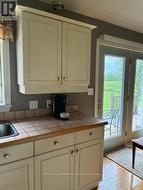 Kitchen counter & sliding door onto deck - 