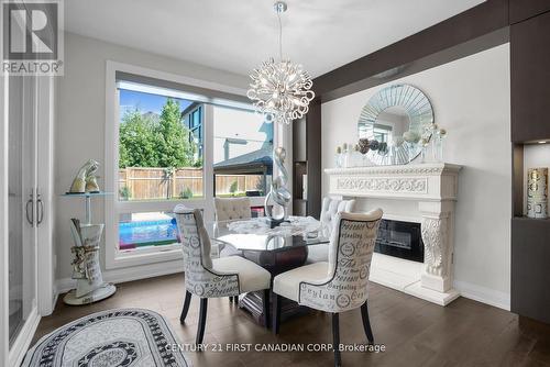 90 Pebblecreek Walk W, London North (North R), ON - Indoor Photo Showing Dining Room With Fireplace