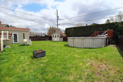 Cour - 408 Rue Lauzanne, Saint-Eustache, QC - Outdoor With Above Ground Pool With Backyard