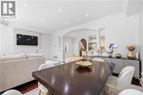 Dining area featuring wood-finish flooring, recessed lighting, and crown molding - 199 Hunter Street W, Hamilton, ON - Indoor Photo Showing Dining Room