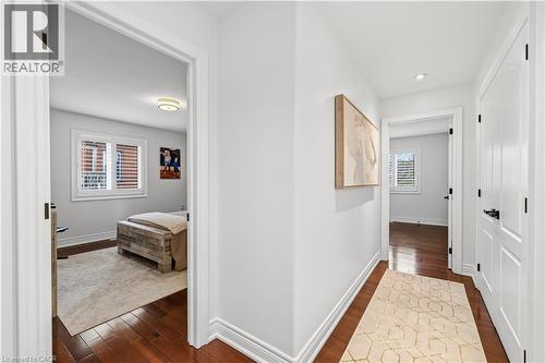 Hallway featuring rich wood-finish flooring, white trim, and recessed lighting - 199 Hunter Street W, Hamilton, ON - Indoor Photo Showing Other Room