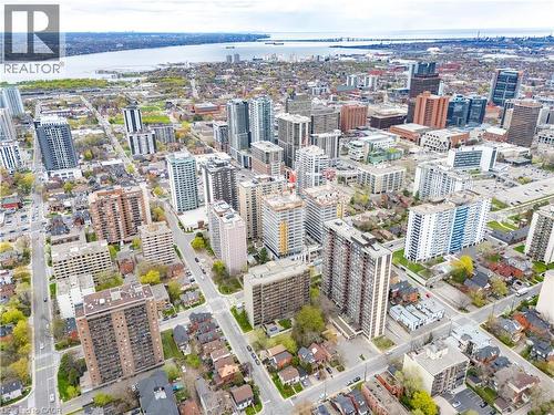 Aerial perspective showcasing a vibrant urban landscape with diverse architectural styles, including high-rise residential buildings and commercial structures - 199 Hunter Street W, Hamilton, ON - Outdoor With View