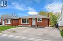 Brick exterior featuring a white entry door and a gravel driveway - 34 Avenue Road, Cambridge, ON  - Outdoor 