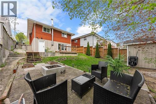 Brick exterior with a lower-level white door entry - 34 Avenue Road, Cambridge, ON - Outdoor With Deck Patio Veranda