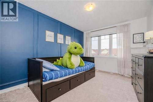 Accent wall featuring blue wainscoting paneling - 525 Cavanagh Lane, Milton, ON - Indoor Photo Showing Bedroom