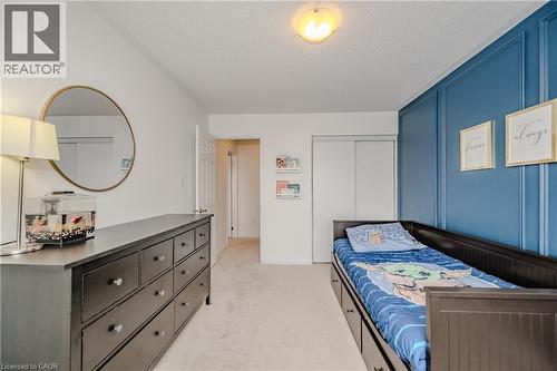 Room featuring light-toned carpeting and white walls - 525 Cavanagh Lane, Milton, ON - Indoor Photo Showing Bedroom