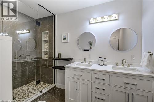 Contemporary bathroom featuring a spacious glass-enclosed shower with tiled walls and a mosaic floor - 29 Wiltshire Place, Ancaster, ON - Indoor Photo Showing Bathroom