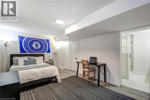 Finished room with wood-finish flooring, recessed lighting, and a glass-enclosed shower featuring white tile flooring - 29 Wiltshire Place, Ancaster, ON - Indoor Photo Showing Bedroom