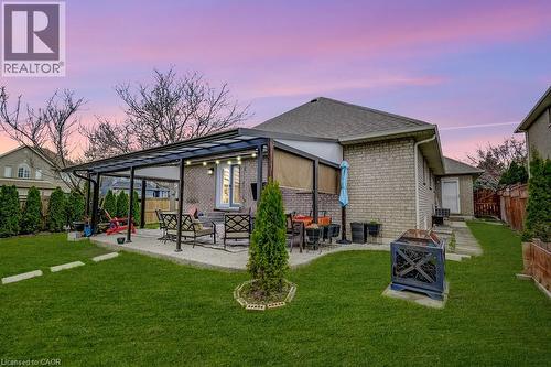 Private backyard featuring a covered patio with integrated lighting - 29 Wiltshire Place, Ancaster, ON - Outdoor