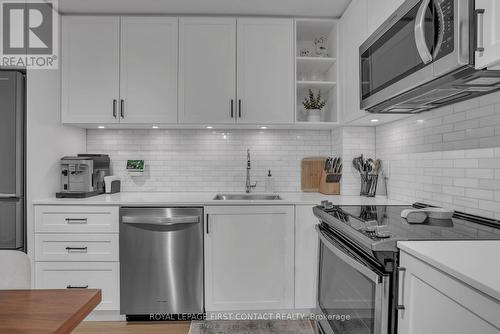 407 - 100 Eagle Rock Way, Vaughan, ON - Indoor Photo Showing Kitchen With Upgraded Kitchen