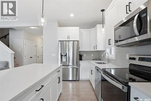 246 Aniskotaw Manor, Saskatoon, SK - Indoor Photo Showing Kitchen With Stainless Steel Kitchen With Double Sink With Upgraded Kitchen