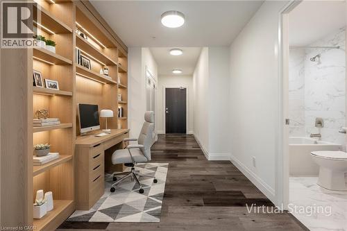 Office area with dark wood finished floors and built in features - 500 Brock Avenue Unit# 808, Burlington, ON - Indoor Photo Showing Office