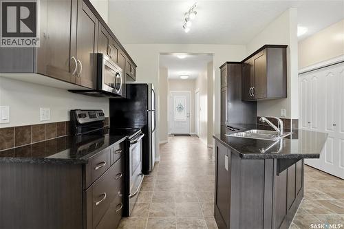 210 3818 Dewdney Avenue E, Regina, SK - Indoor Photo Showing Kitchen With Double Sink