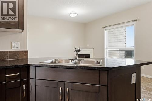 210 3818 Dewdney Avenue E, Regina, SK - Indoor Photo Showing Kitchen With Double Sink
