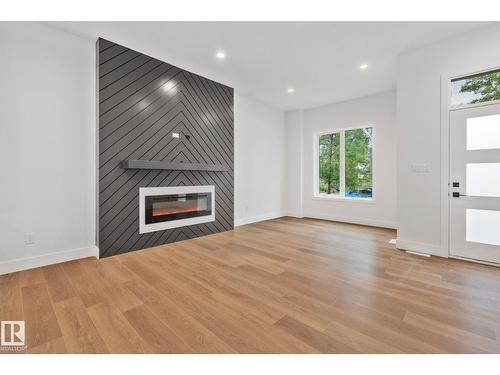 11036 128 St Nw, Edmonton, AB - Indoor Photo Showing Living Room With Fireplace