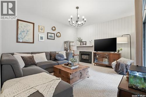 16 425 Pinehouse Drive, Saskatoon, SK - Indoor Photo Showing Living Room With Fireplace