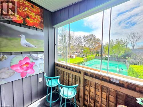 Enclosed balcony/sun room featuring large glass panels, vertical board and batten wall paneling - 16 Forest Hill Road, St. Catharines, ON -  Photo Showing Other Room