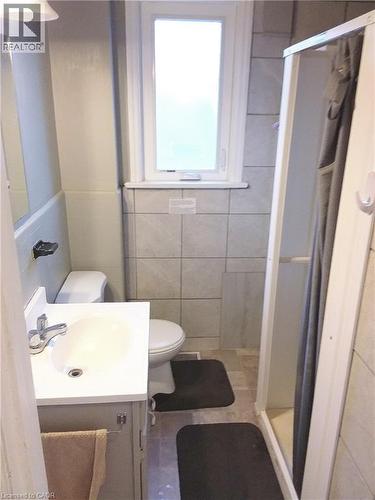 Main floor bathroom featuring a vanity with a white countertop and a stand-up shower - 16 Forest Hill Road, St. Catharines, ON - Indoor Photo Showing Bathroom