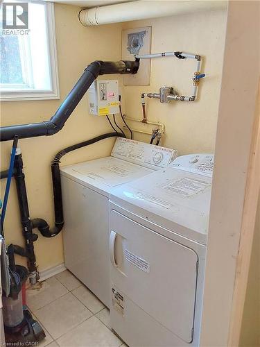 Laundry is coin operated - 16 Forest Hill Road, St. Catharines, ON - Indoor Photo Showing Laundry Room