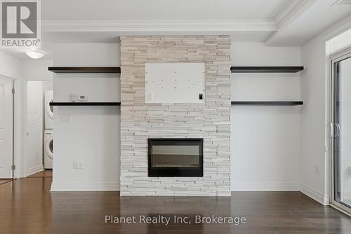 501 - 150 Wellington Street E, Guelph (Downtown), ON - Indoor Photo Showing Other Room With Fireplace