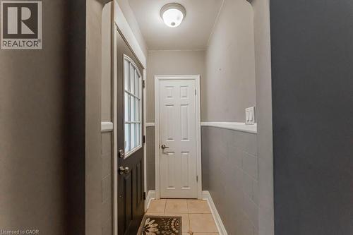 Doorway to outside with light tile patterned floors and tile walls - 501 Upper Wellington Street, Hamilton, ON - Indoor Photo Showing Other Room