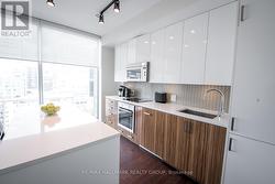 Kitchen w/Quartz Counters and European Appliances - 