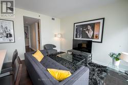 Living Room w/Hardwood & Floor-to-Ceiling Windows - 