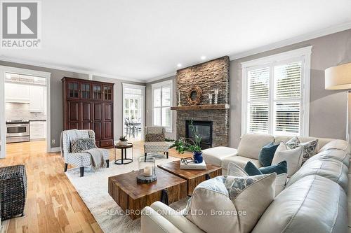32 Feldspar Crescent, Ottawa, ON - Indoor Photo Showing Living Room With Fireplace