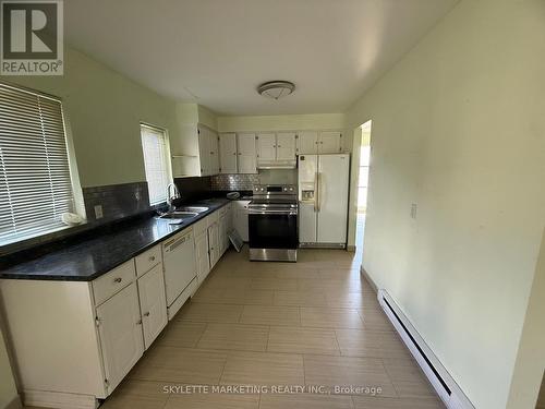 24 - 2 Paradise Boulevard, Ramara, ON - Indoor Photo Showing Kitchen With Double Sink