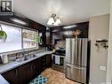 24 Dryburgh Crescent, Regina, SK  - Indoor Photo Showing Kitchen With Double Sink 
