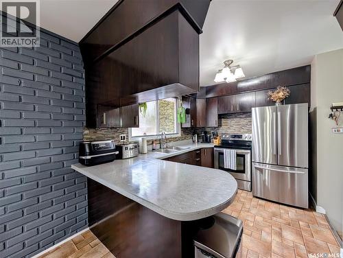 24 Dryburgh Crescent, Regina, SK - Indoor Photo Showing Kitchen With Double Sink