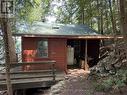 West side of the cottage, outdoor kitchen area - Apl1136E - 19 Cache Lake, South Algonquin, ON  - Outdoor 