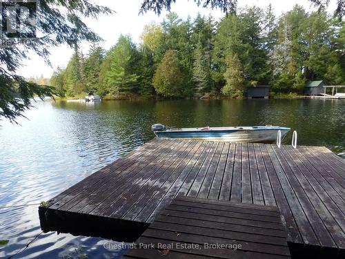 Looking across at Wahbahmini Island from the dock - Apl1136E - 19 Cache Lake, South Algonquin, ON - Outdoor With Body Of Water With Deck Patio Veranda