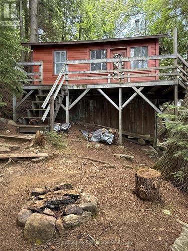 East side of the cottage, stairs to the entrance - Apl1136E - 19 Cache Lake, South Algonquin, ON - Outdoor With Deck Patio Veranda