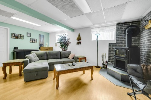 Family Room - 133 Rue Marguerite, Sainte-Agathe-Des-Monts, QC - Indoor Photo Showing Other Room With Fireplace