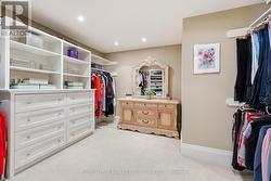 Primary Walk-In Closet with Custom Built- - 