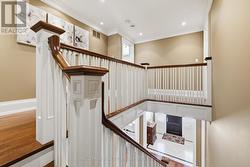 Hardwood Staircase Leading Down to the Main Level - 