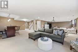Recreation Area with a Gas Fireplace & Custom Bar - 