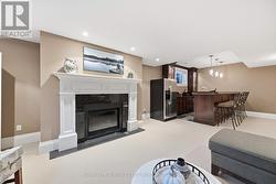 Recreation Area with a Gas Fireplace & Custom Bar - 