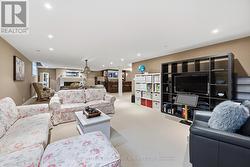 Recreation Area with a Gas Fireplace & Custom Bar - 