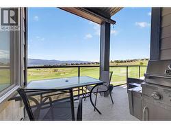 Main floor covered deck with golf and lake view - 