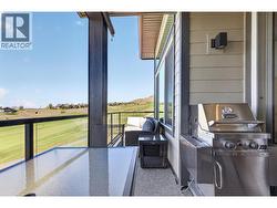 Main floor covered deck with golf and lake view - 