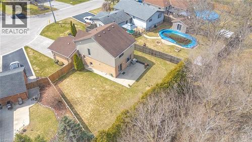 Two-story residence featuring brick and siding exterior, an attached garage, and a fenced backyard with a patio - 200 Morrison Drive, Caledonia, ON - Outdoor With View