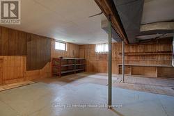 LOWER LEVEL WORKSHOP WITH WALKOUT TO BACKYARD - 