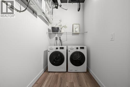 Laundry. Photos may be of a similar home in the community. - 1111 Frost Road Unit# 202, Kelowna, BC - Indoor Photo Showing Laundry Room